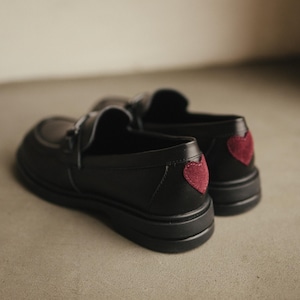 Classic black leather loafers with unique red suede insert decoration