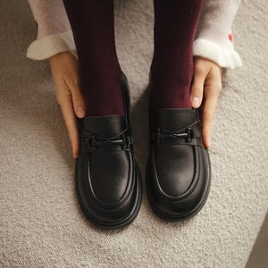 Handmade women’s loafers in genuine black leather with heart design