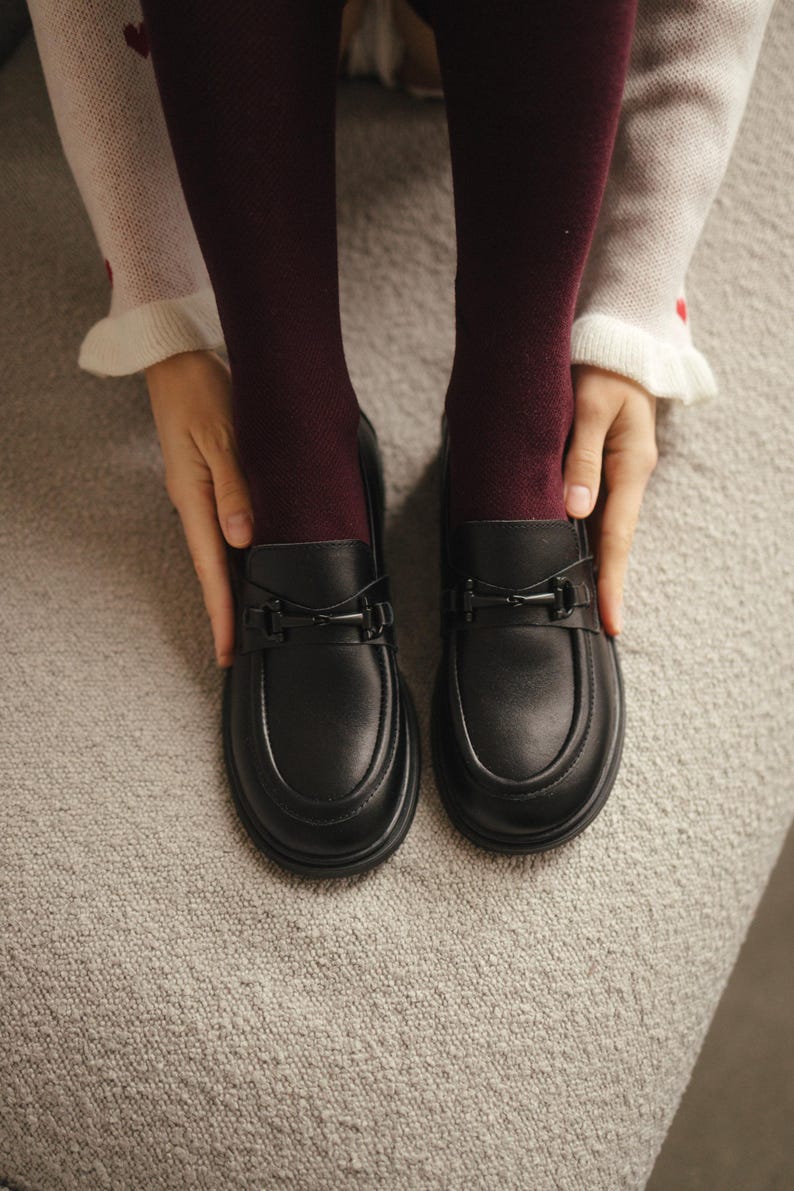 Handmade women’s loafers in genuine black leather with heart design