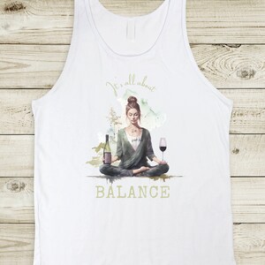 A woman sitting in a lotus position meditating, holding a glas of wine in one hand and a bottle of wine in the other. Text: It's all about balance.