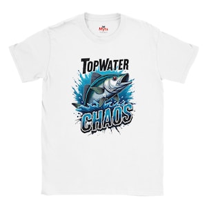 May include: White t-shirt featuring a graphic of a fish leaping out of water, with the words "Topwater Chaos" in black and blue. The design includes splashes of blue water around the fish, creating a dynamic visual.