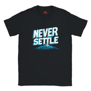 May include: Black t-shirt featuring the text "NEVER SETTLE" in white with a blue shadow, above a blue mountain illustration. The tee has a crew neck and short sleeves. The brand logo "Myts" is on the upper back.