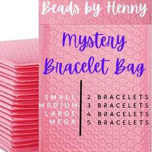 May include: Pink bubble mailers with the text "Beads by Henny" and "Mystery Bracelet Bag" in white. The mailers are stacked on top of each other. The text "Small, Medium, Large, Mega" is listed with the corresponding number of bracelets: 2, 3, 4, and 5.