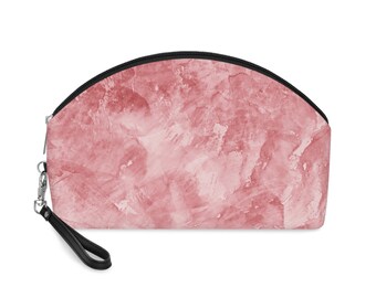 Make-uptasje met prachtig roze marmeren abstract patroon