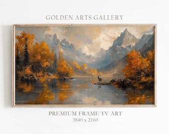 Pode incluir: Uma pintura de paisagem emoldurada que retrata um lago de montanha com um veado em pé em uma pequena ilha em primeiro plano. O lago é cercado por árvores com folhas amarelas e laranja, e as montanhas ao fundo estão cobertas de neve. A pintura está em uma moldura de madeira clara.