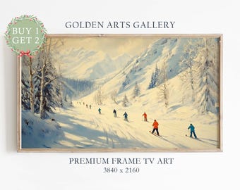 May include: A framed landscape painting depicts skiers on a snowy mountain slope. The artwork features a winter scene with skiers in colorful attire, set against a backdrop of snow-covered trees and mountains. The text "GOLDEN ARTS GALLERY" and "PREMIUM FRAME TV ART" are visible.