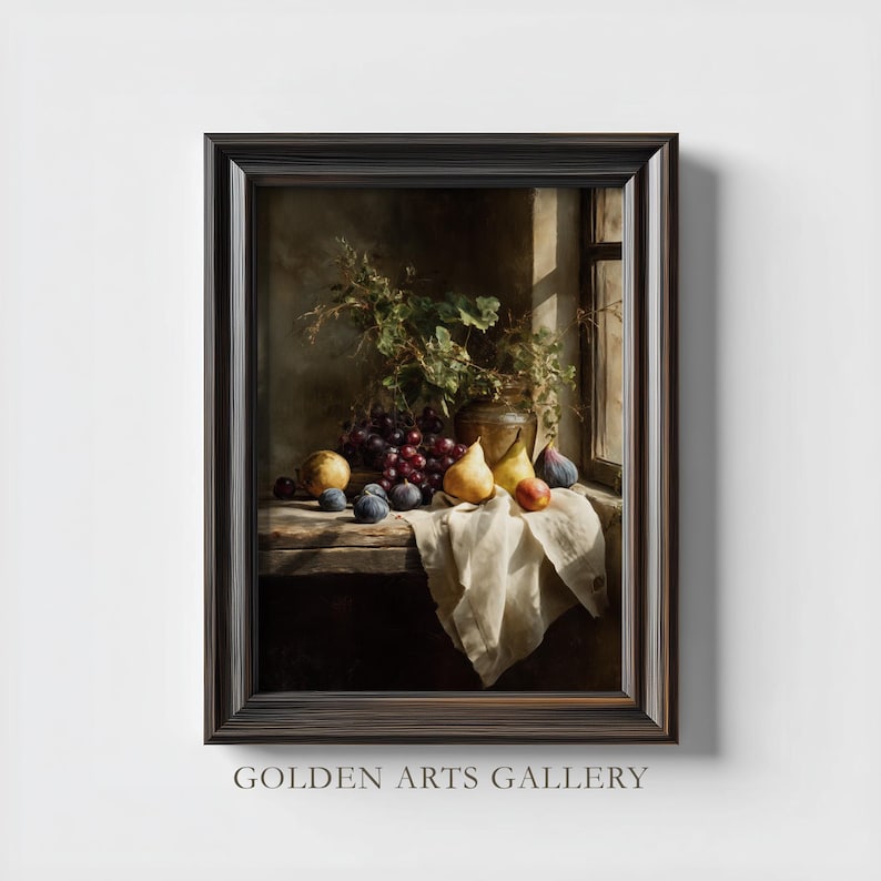 May include: A framed still life painting featuring a wooden table with a variety of fruits, including grapes, pears, and figs. A vase with greenery sits near a window. The painting is framed in a dark brown wooden frame. The text "GOLDEN ARTS GALLERY" is at the bottom.