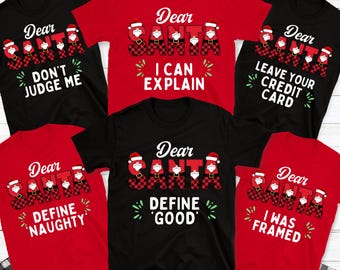 May include: A collection of black and red t-shirts with the words "Dear Santa" and various phrases. The Santa letters are designed with a buffalo plaid pattern. Phrases include "Don't Judge Me," "I Can Explain," and "Leave Your Credit Card."