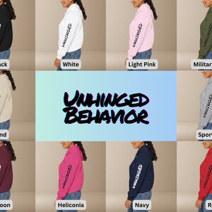 May include: A collection of hoodies in various colors, including black, white, light pink, military green, sand, sport grey, maroon, heliconia, navy, and red. The hoodies feature the text "UNHINGED BEHAVIOR" on the sleeve.
