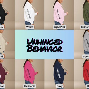May include: A collection of hoodies in various colors, including black, white, light pink, military green, sand, sport grey, maroon, heliconia, navy, and red. Each hoodie features the text "UNHINGED" on the sleeve and "UNHINGED BEHAVIOR" in a stylized font on the front.