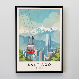 May include: A framed art print featuring a red cable car ascending towards snow-capped mountains. The cityscape of Santiago, Chile, is visible below, with a tall skyscraper and lush green trees. The print has a vintage travel poster style with the city name at the bottom.