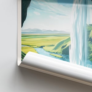May include: A landscape print featuring a waterfall cascading down a cliffside. The scene includes a river, green fields, and mountains under a blue sky. The edge of the print is curled.