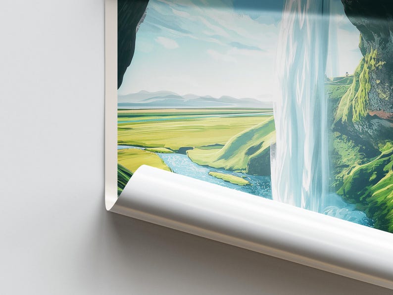 May include: A landscape print featuring a waterfall cascading down a cliffside. The scene includes a river, green fields, and mountains under a blue sky. The edge of the print is curled.