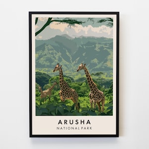 May include: A vintage-style poster featuring a scenic landscape with mountains and lush greenery. Three giraffes are walking through the foliage. The text "Arusha National Park" is printed at the bottom of the poster.