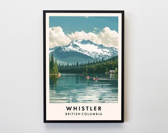 May include: A framed art print featuring a serene lake scene with snow-capped mountains in the background. The image includes evergreen trees, a blue sky with fluffy clouds, and the text "Whistler British Columbia" at the bottom.