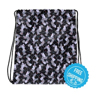 May include: Black drawstring bag with a geometric pattern in shades of grey, white, and black. The pattern includes small colourful dots. The bag has a white label with the text "FREE SHIPPING" in blue and a small truck icon.
