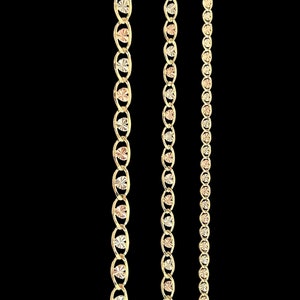 May include: Three gold chains with a diamond-cut design. The chains are different lengths and widths.