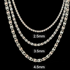 May include: Three gold chains with a heart-shaped design. The chains are 2.5mm, 3.5mm, and 4.5mm wide.