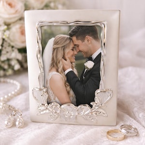 May include: A rustic wooden sign with the text "Welcome to our home" in white lettering. The sign features a distressed finish and a simple, inviting design, perfect for front door decor.