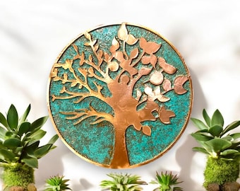 May include: A circular wall decor featuring a copper tree of life design with a turquoise background. The tree has intricate branches and leaves, creating a detailed and elegant look.