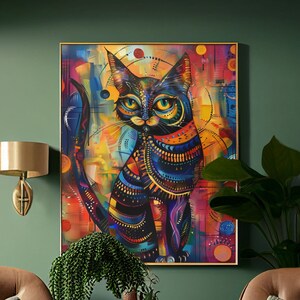 A vibrant, colorful cat artwork hanging on a green wall, complemented by two chic brown-beige chairs and lush indoor plants, creating a harmonious blend of nature and art in a cozy interior setting.