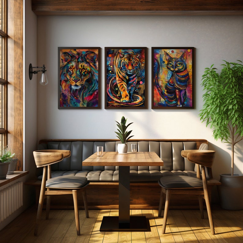 Collection of three abstract animal art pieces in a restaurant: lion, tiger, cat.
