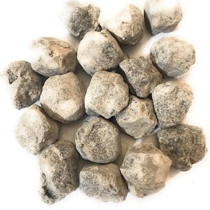May include: A pile of small, round, gray and white stones. The stones are smooth and have a slightly rough texture.