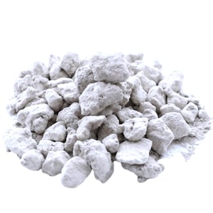 May include: A pile of white, powdery, irregularly shaped rocks. The rocks are clustered together in a mound.