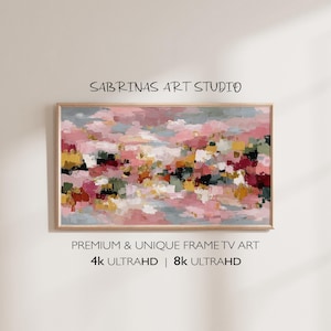 May include: Abstract art print in a wooden frame. The artwork features a colorful palette of pink, yellow, green, and dark red brushstrokes. The text "SABRINAS ART STUDIO" is at the top, and "PREMIUM & UNIQUE FRAME TV ART" and "4K ULTRAHD | 8K ULTRAHD" are at the bottom.