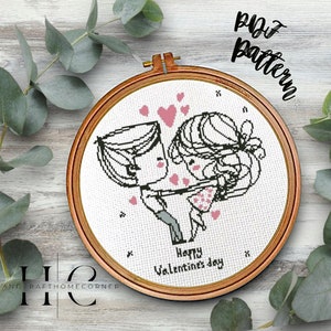 May include: A cross-stitch pattern featuring a couple holding hands with hearts around them. The pattern includes the text "Happy Valentine's Day".