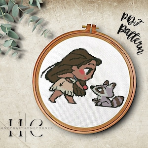 May include: Cross stitch pattern featuring a cartoon image of Pocahontas from Disney's Pocahontas, with a brown and grey raccoon. The pattern is displayed in a wooden embroidery hoop.