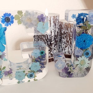 Resin letter with real flowers inside
