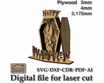 May include: A laser cut Halloween decoration made of plywood. The decoration features a coffin with a haunted house inside and the words "Happy Halloween". The decoration is available in 3mm or 4mm plywood and measures 3.175 inches tall.