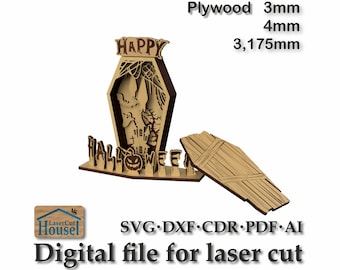 May include: A laser cut wooden Halloween decoration featuring a coffin with a ghost inside and the words "HAPPY HALLOWEEN". The decoration is available in 3mm, 4mm, and 3.175mm plywood.