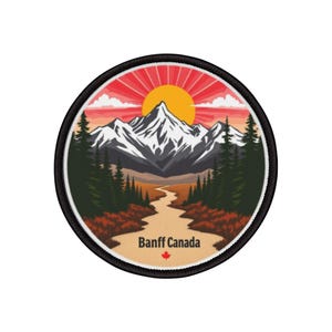 May include: Circular patch depicting a mountain scene with a setting sun and a river. The patch has a black border and the text "Banff Canada" with a maple leaf. The design features orange, red, green, and white colours.