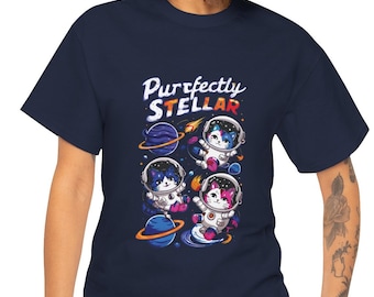 May include: A navy blue t-shirt featuring a graphic of three cats in astronaut suits floating in space. The text "Purrfectly Stellar" is printed above the cats.