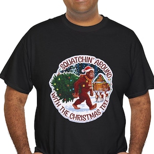 Squatchin Around Christmas Tree Tee, Festive Sasquatch Shirt, Bigfoot with Reindeer T-Shirt, Bigfoot Holiday Fun Tee, Gift for Bigfoot Lover