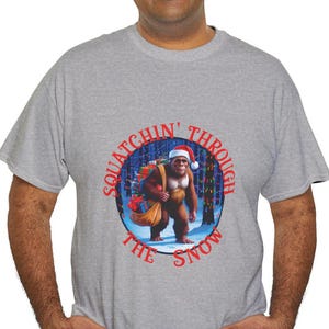 Squatchin Through The Snow, Christmas Bigfoot Tee, Festive Bigfoot Santa Tshirt, Holiday Sasquatch T-Shirt,Gift for Bigfoot  Sasquatch Lover
