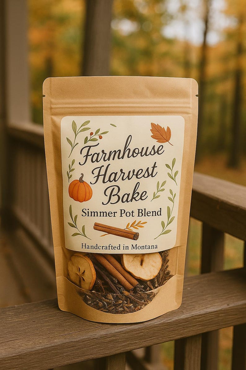 May include: A brown paper bag labeled "Farmhouse Harvest Bake Simmer Pot Blend" with a pumpkin and leaf design. The bag contains dried apple slices, cinnamon sticks, and other herbs. "Handcrafted in Montana" is printed at the bottom.