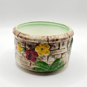 May include: A rustic wooden sign with the text "Welcome to our home" in a handwritten style. The sign has a distressed finish and a simple, inviting design, ideal for a front porch or entryway.