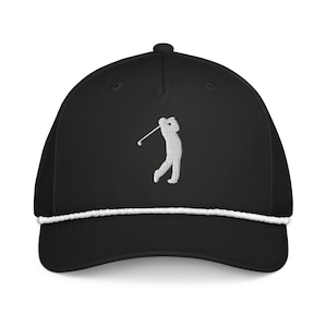 May include: Black golf cap with a white embroidered golfer silhouette. The cap features a white rope detail along the brim and a curved visor. A stylish accessory for golf enthusiasts.
