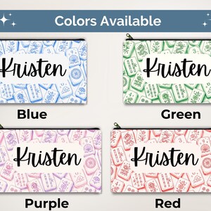 May include: Four rectangular zippered pouches featuring a mahjong tile pattern in blue, green, purple, and red. Each pouch has a central white rectangular label with the name Kristen printed in black script. The text Colors Available is at the top.