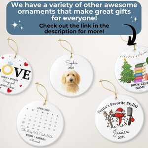 May include: A collection of white ceramic ornaments with gold string hangers. Designs include a ring with the word "LOVE", a dog portrait, a Christmas tree, a calendar, and a Santa-themed design. Text on the ornaments includes names and dates.