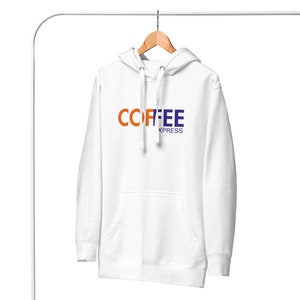 Pode incluir: Moletom branco com capuz com um gráfico "COFFEE XPRESS" azul e laranja.