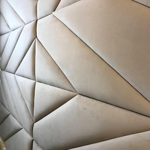 Custom upholstered wall panels. Geometric soft headboard accent for modern bedroom or living room