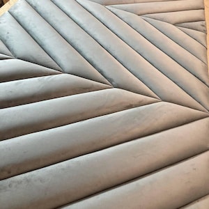 Custom upholstered wall panels. Geometric soft headboard accent for modern bedroom or living room
