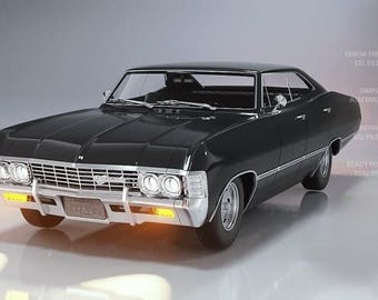 May include: A black classic car with chrome accents, including a front grille and bumpers. The car has a sleek, vintage design with a low profile and a black roof. The headlights and turn signals are illuminated. The car is a 1967 Chevrolet Impala.