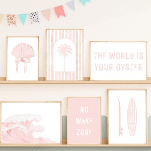 This 6-piece digital wall art set features soft, pastel watercolor illustrations with a coastal, beachy theme in shades of pink.
Watercolor Wave – A flowing ocean wave.
Seashell with Pink Bow – A light pink scallop shell with gentle shading, topped with a dainty pink bow, adding a cute and feminine touch.
“The World is Your Oyster” Quote.
“No Wake Zone” Quote – A bold but friendly phrase in stylized, textured letters, suggesting peace and calm, like a sign near still waters.