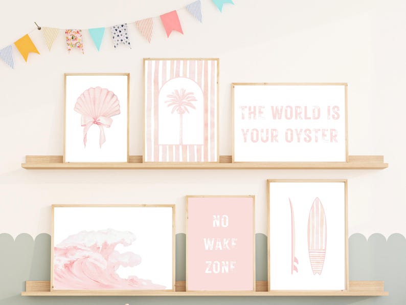 This 6-piece digital wall art set features soft, pastel watercolor illustrations with a coastal, beachy theme in shades of pink.
Watercolor Wave – A flowing ocean wave.
Seashell with Pink Bow – A light pink scallop shell with gentle shading, topped with a dainty pink bow, adding a cute and feminine touch.
“The World is Your Oyster” Quote.
“No Wake Zone” Quote – A bold but friendly phrase in stylized, textured letters, suggesting peace and calm, like a sign near still waters.