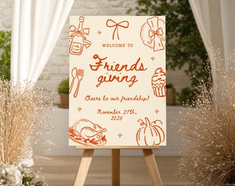 May include: A rectangular cream-colored sign featuring orange line-art illustrations of a wine bottle, bow, plate, cutlery, cupcake, turkey, and pumpkin. The text reads: WELCOME TO Friendsgiving, Cheers to our friendship!, November 27th, 2025.
